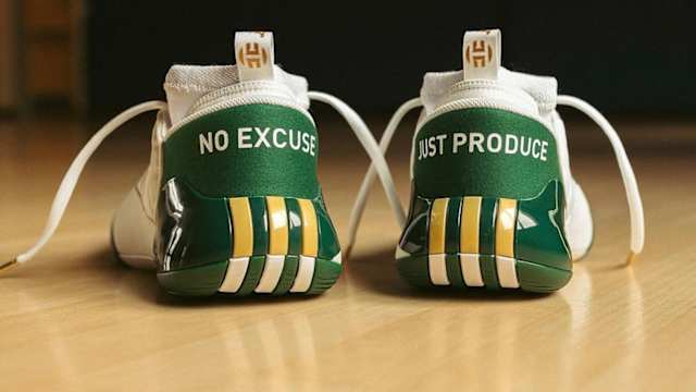 Rear view of James Harden's green and gold adidas shoes.